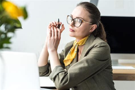 Beautiful Pensive Businesswoman Sitting At Workplace And Looking Away Stock Image Image Of