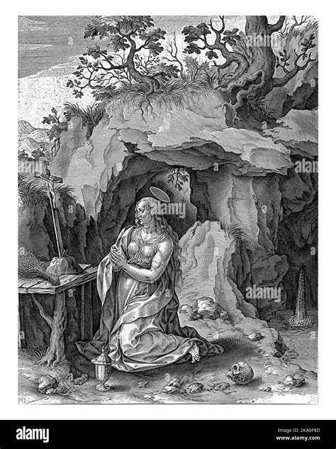 the penitent mary magdalene prays before a crucifix in a cave a waterfall flows into the cave