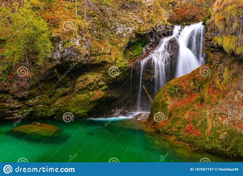 The Mountain Waterfall Falls Into The Green Lake Stock Image Image Of