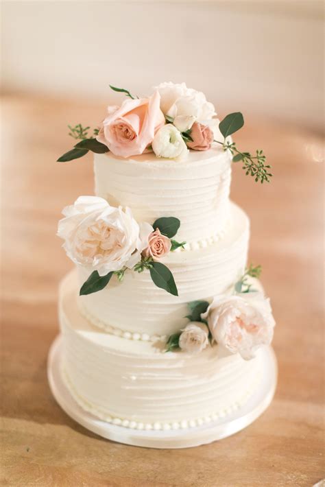 3 Tier Buttercream Wedding Cake In Swirl Design With Fresh Blooms Decor