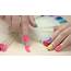 Manicured Hand Choosing Nail Polish Artificial Nails On Transparent 