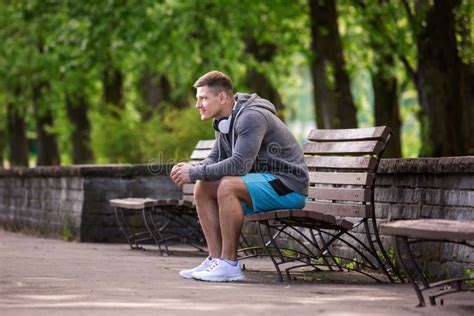 Man Sitting On The Bench In Park Stock Photo Image Of Grey