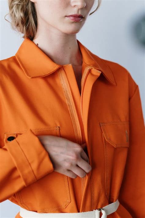 A Woman In Orange Overall Suit · Free Stock Photo
