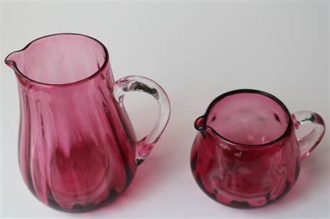 Vintage Pilgrim Hand Blown Cranberry Glass Two Small Pitchers W Clear Glass Handles