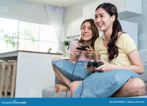 Asian Beautiful Lesbian Woman Couple Enjoy Play Game Together In House
