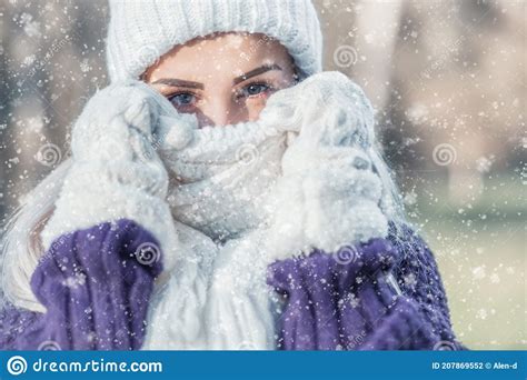 Winter Portrait Of Young Beautiful Woman Freezing And Covering Her Face