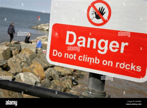 Danger Sign Warning Of Risks Associated With Climbing On The Rock