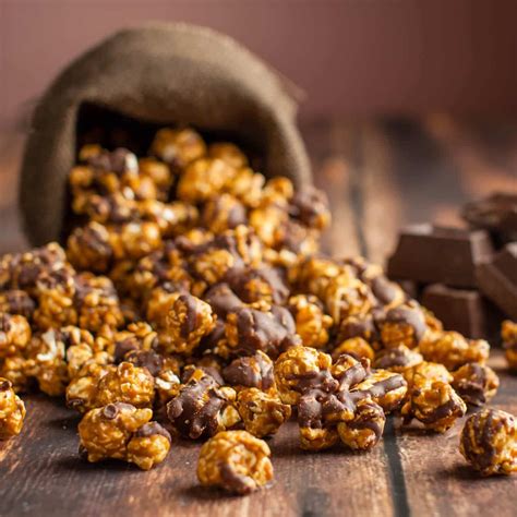 caramel chocolate drizzle gourmet popcorn popinsanity in 2021 chocolate drizzled popcorn