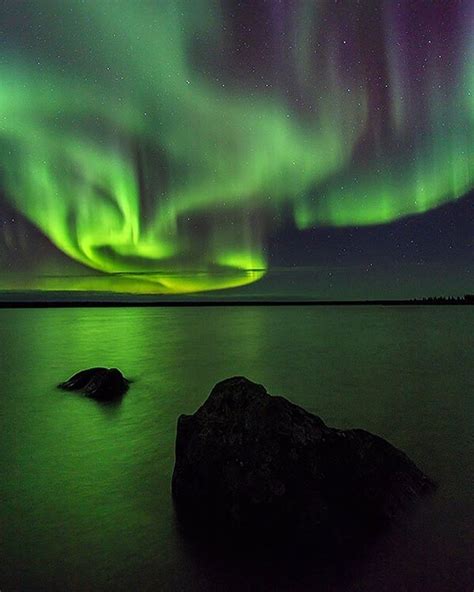 The Northern Lights Over Ennadai Lake In Nunavut Canada By John E
