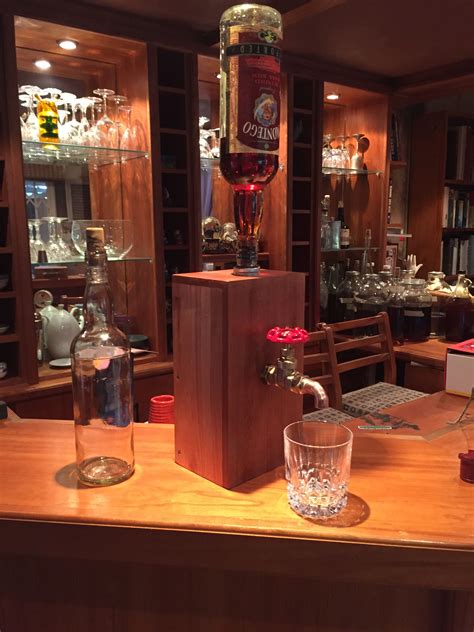 Let the cabinet guys examine your cabinets and make a recommendation as to the best process for your kitchen remodel. whiskey tap by Guy | Decor, Home decor, Liquor cabinet