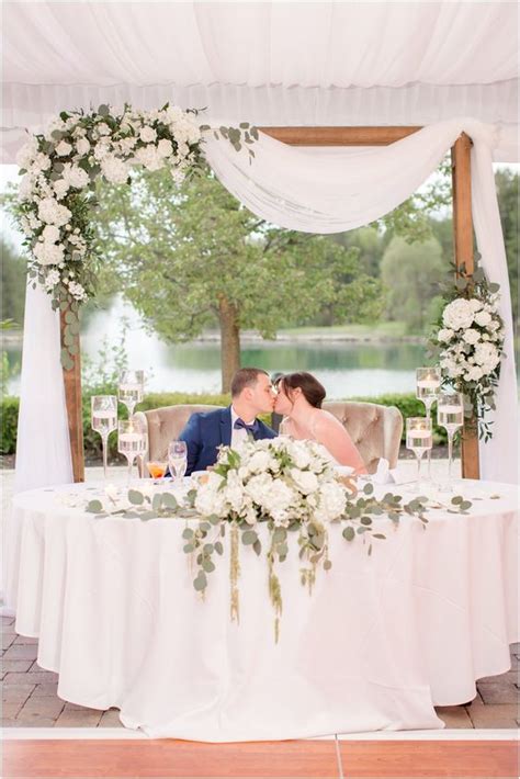 A Wedding Arch Placed Right Behind The Sweetheart Table Lush Neutral