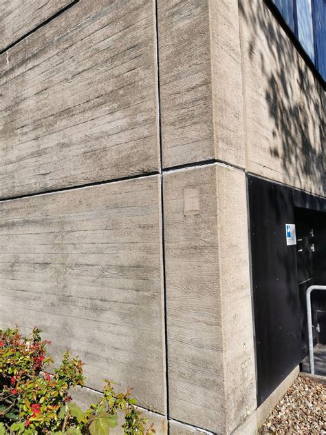 The cement plates on this building are supposed to look like wood
