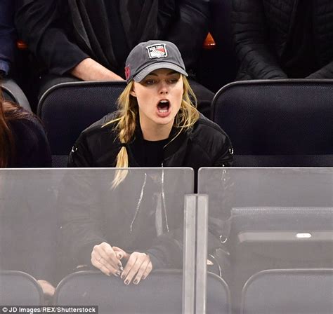 Margot Robbie Glugs Lager As She Puts On An Animated Display At Ice Hockey Game In Nyc Daily