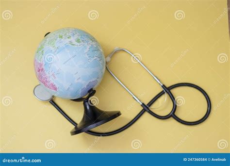 Globe And Stethoscope On Yellow Background World Health Day Concept