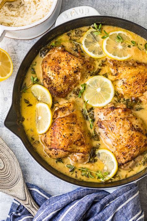 Chicken With Lemons And Herbs In A Skillet