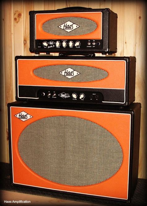Two Orange Amps Stacked On Top Of Each Other