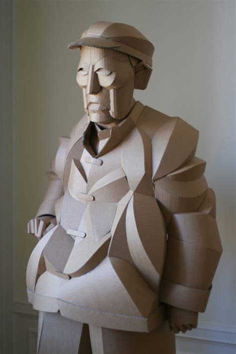 Warren King Uses Cardboard To Sculpt Full Scale Villagers Of His