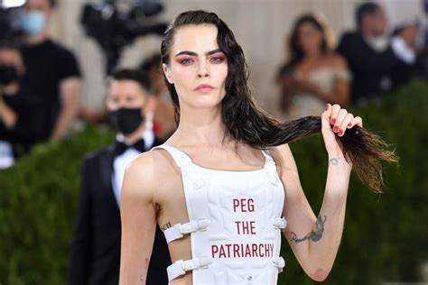 Cara Delevingne Shows Gold Painted Breasts At Met Gala