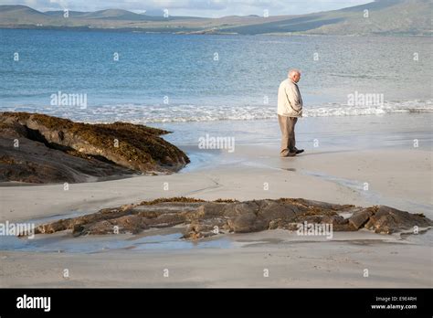 Man Walking On Tully Cross Beach Connemara National Park County