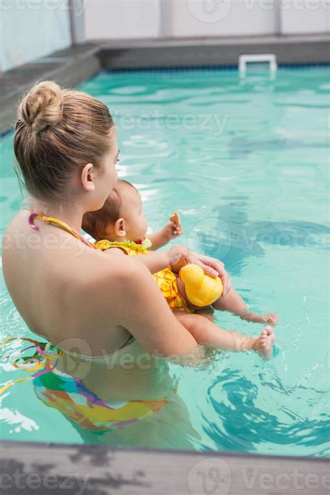 Necring ab (pilih warna biru,orange,pink,hijau) 3. Pretty mother and baby at the swimming pool 788262 Stock Photo