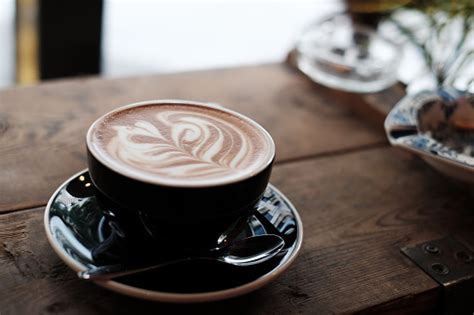 Mocha Art On Rustic Wood Stock Photo Download Image Now Froth Art