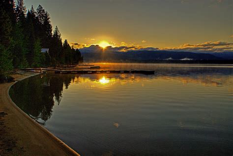 Visitors enjoy fishing, canoeing and exploring local trails. Sunrise, Payette Lake, McCall, Idaho | Tonemapped single ...