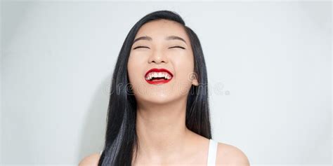 Woman With Bare Shoulders Laughs With Her Mouth Wide Open Stock Image