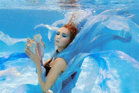 Premium Photo Underwater Fashion Portrait Of Beautiful Young Woman In Blue Dress