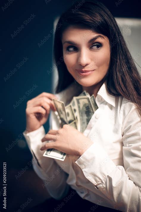 Suspicious Business Woman Hiding Cash Inside Of Her Bra Close Portrait