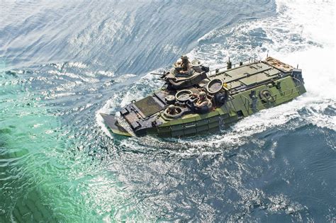 An Amphibious Assault Vehicle Prepares To Enter The Well Deck Of The