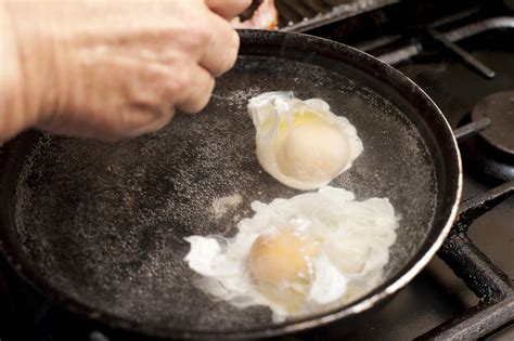 Preparing Two Poached Eggs Free Stock Image