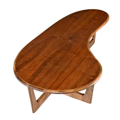 This white base holds an amoeba ( a type of kidney) glass that is 33 x 48 & 1/2″ thick with a pencil polish edge work. Boomerang Amoeba Shape Coffee Table, Adrian Pearsall Style Solid Oak and Walnut at 1stdibs