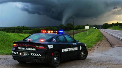 Photo Of Nebraska State Patrol Cruiser With Tornado In The Background