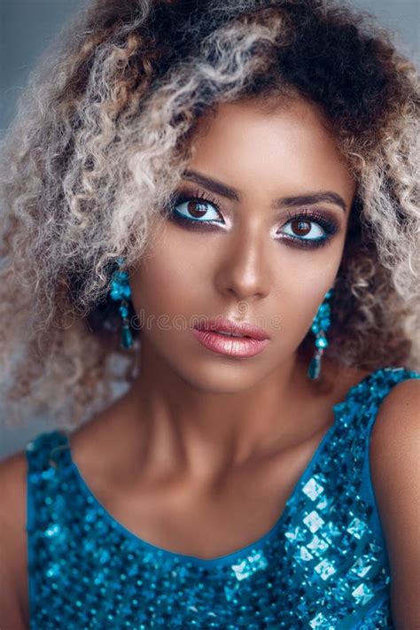 Close Up Portrait Of Mixed Woman With Bright Make Up Stock Photo
