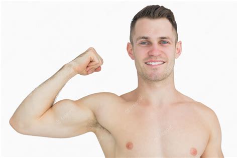 Premium Photo Portrait Of Shirtless Young Man Flexing Muscles