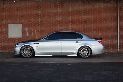 Clean styling, a great engine and just a complete package overall. Slammed BMW E60 M5 with 20 inch Gunmetal Forgestar F14 Wheels