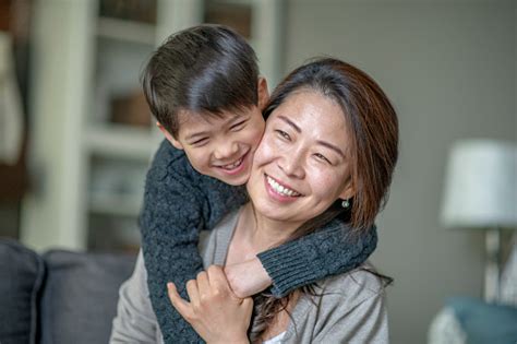 Asian Mother And Son Sharing A Close Moment Stock Photo Download