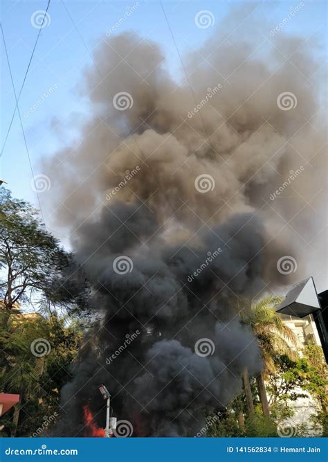 Black Smoke Coming Out Of A Building On Fire Stock Photo Image Of