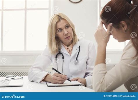 Doctor Consulting Woman In Hospital Stock Photo Image Of Handscure