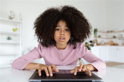 Closeup Of Cute Black Preteen Girl Typing On Laptop Keyboard Stock