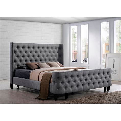 Platform bed designed for use with mattress, no foundation required; DREAM BED A button-tufted, winged headboard and footboard ...