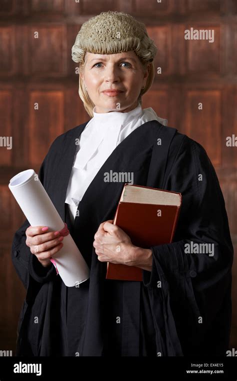Portrait Of Female Lawyer In Court Holding Brief And Book Stock Photo