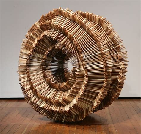 Hundreds Of Pieces Of Stacked Wood Form Beautifully Organic Sculptures