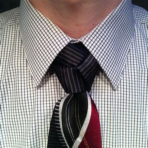 The finished knot shares a resemblance with the celtic triquetra knot. How to Tie a Trinity Necktie Knot - AGREEorDIE | Tie, Tie knots men, Neck tie knots