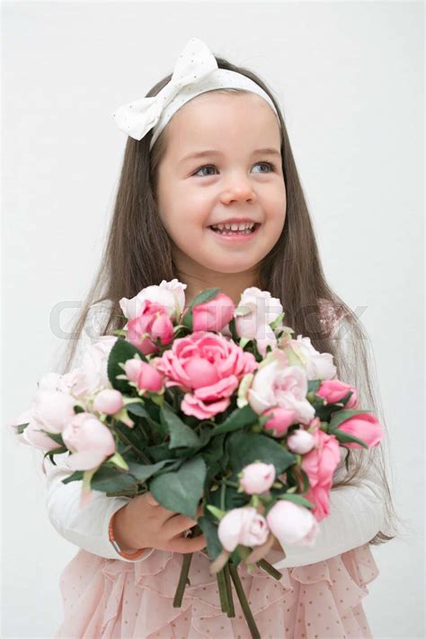 Little Girl Holding Flowers Stock Image Colourbox