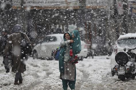 Heavy snowfall gave people some respite from the intense cold wave but disrupted normal life in kashmir valley. In photos: Jammu and Kashmir gets first snowfall of the ...