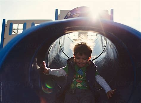 Boy Inside Slide By Stocksy Contributor Maria Manco Stocksy