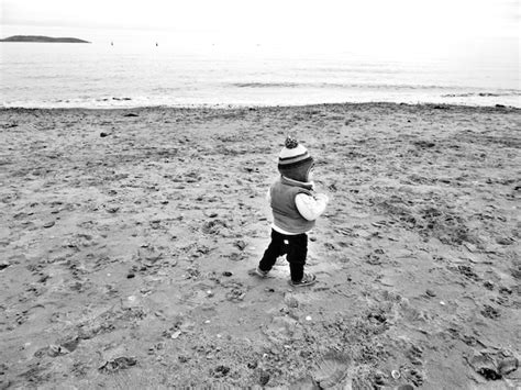 Premium Photo Rear View Of Baby Boy Standing At Beach