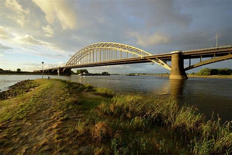 Waal Bridge Over The Waal River In Nijmegen During The Golden Hour