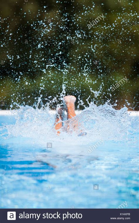 Woman Diving Into Swimming Pool High Resolution Stock Photography And